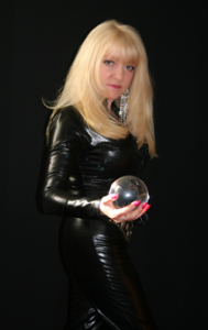 Mistress Marisa holding a crystal ball